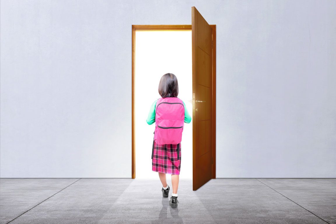 schoolgirl walking through door